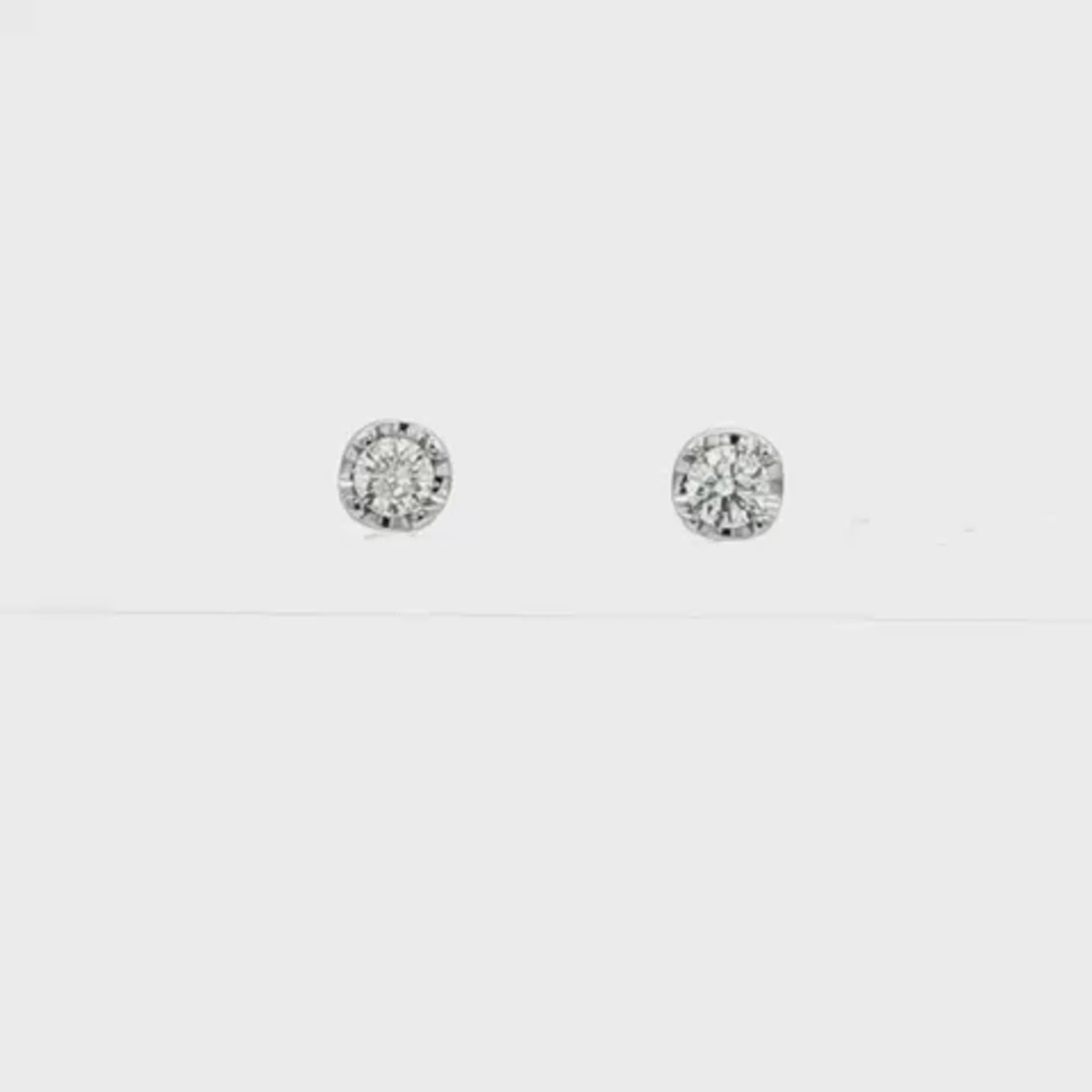 18K White gold stud earrings set with round brilliant diamonds. Item J37480 - ABC Jewelry Co.