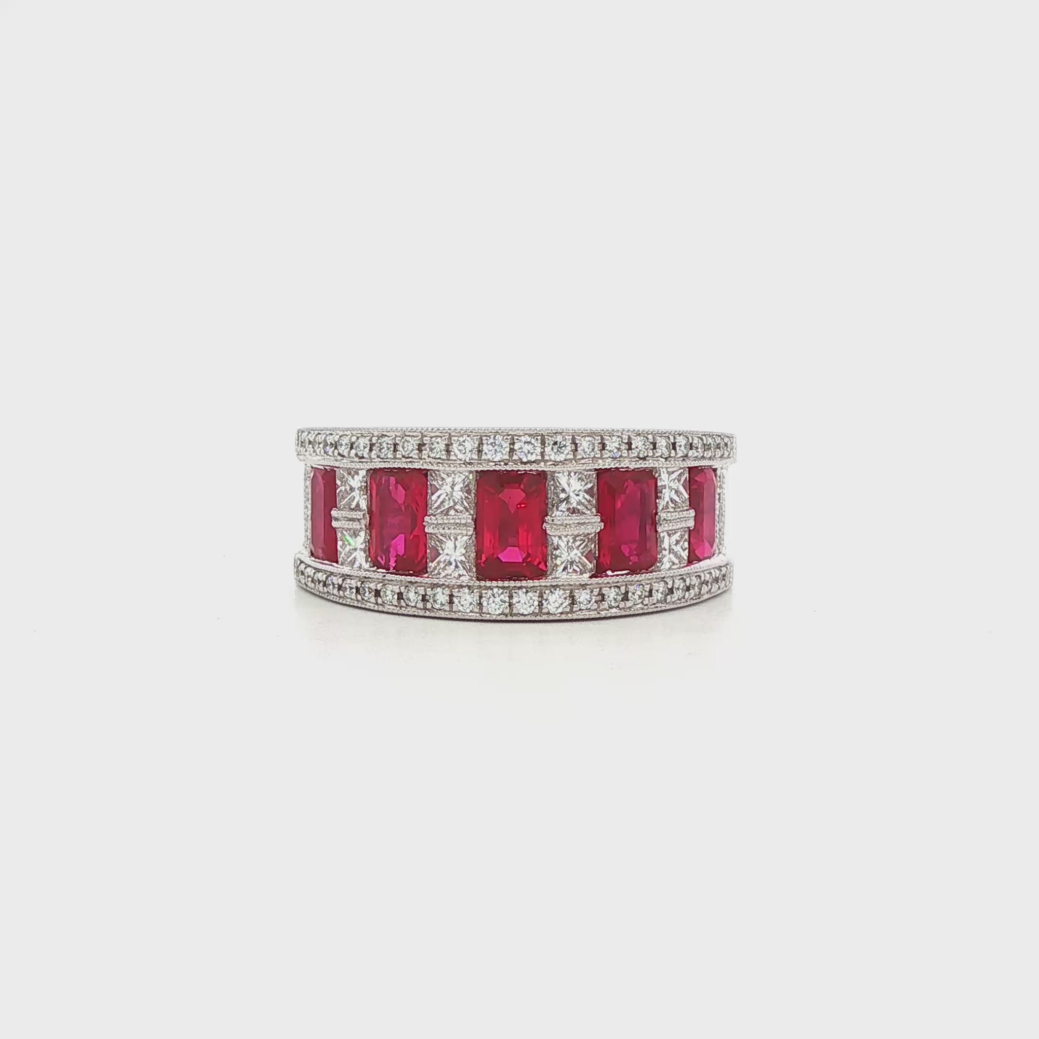 18K White gold ring set with emerald cut rubies and princess cut diamonds. Item J35824 - ABC Jewelry Co. 