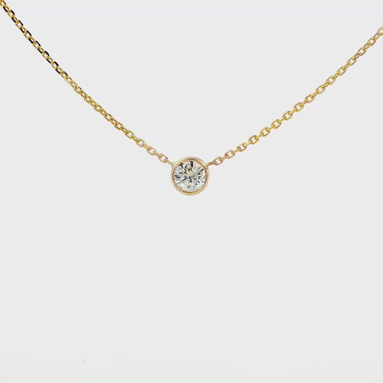 14K Yellow gold bezel set solitaire necklace. Item J38378 - ABC Jewelry Co