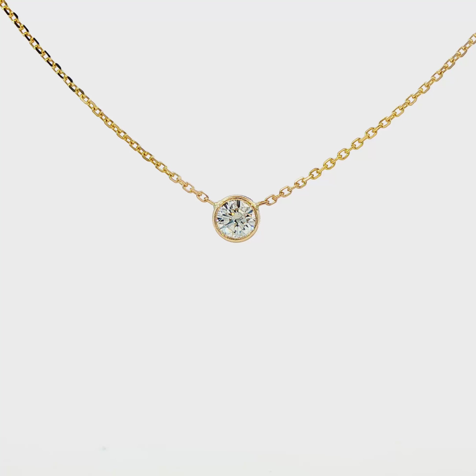 14K Yellow gold bezel set solitaire necklace. Item J38378 - ABC Jewelry Co