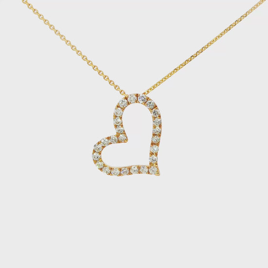 18K Yellow gold heart shaped pendant set with round brilliant diamonds. Item J37108 - ABC Jewelry Co.