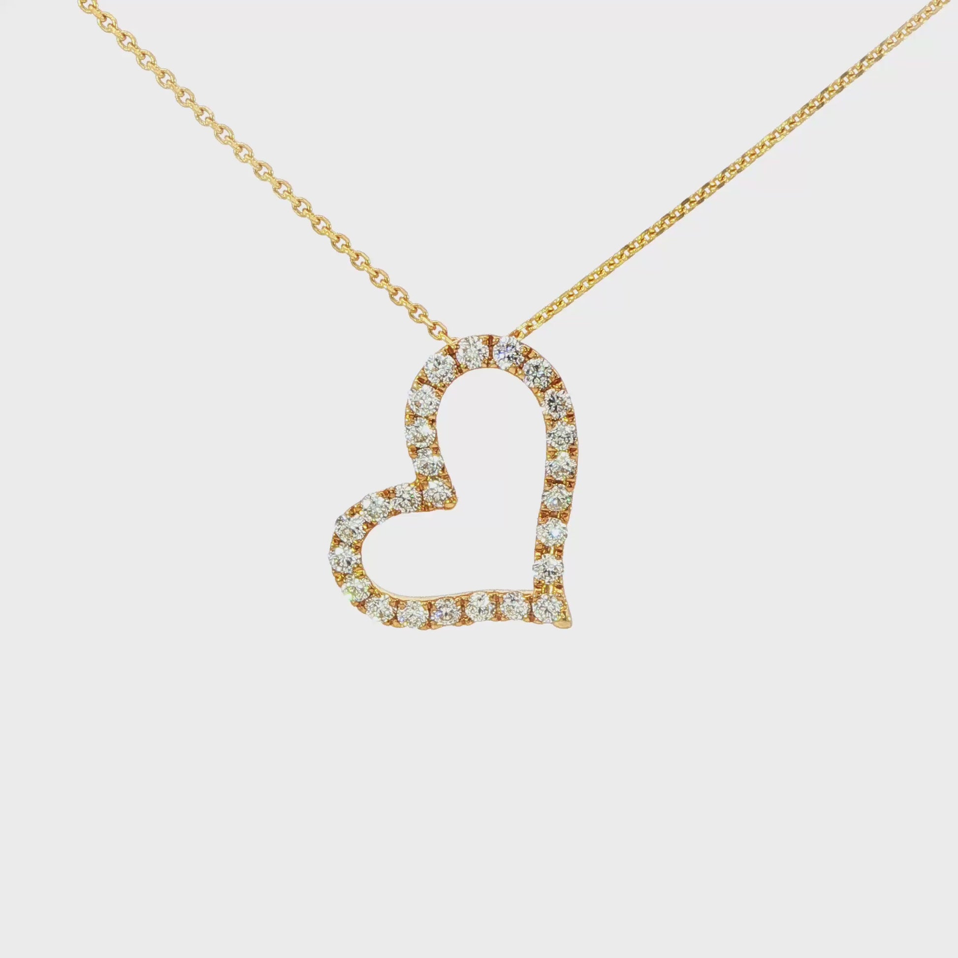 18K Yellow gold heart shaped pendant set with round brilliant diamonds. Item J37108 - ABC Jewelry Co.