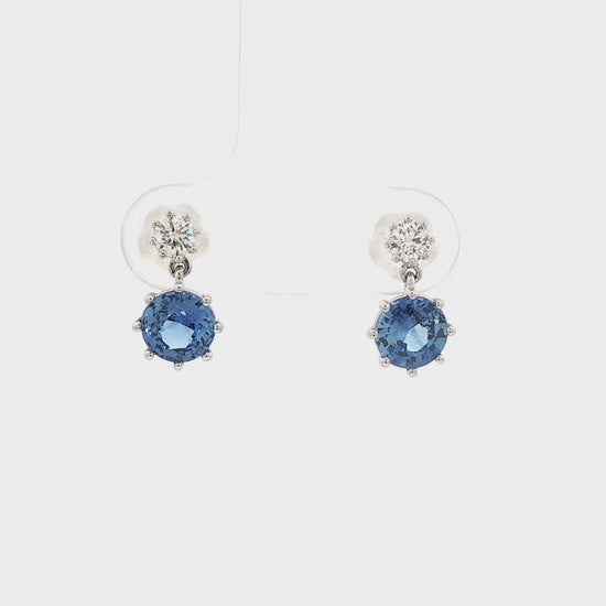 14K White gold drop earrings set with blue sapphires and round brilliant diamonds. Item J37495 - ABC Jewelry Co.