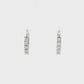 14K White gold diamond set oval hoop earrings. Item J38768 - ABC Jewelry Co.