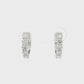 18K White gold diamond set huggies. Item J38849 - ABC Jewelry Co.