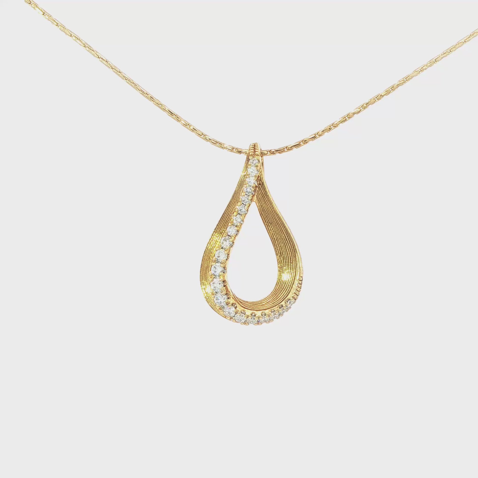 14K Yellow gold teardrop pendant set with graduating round brilliant diamonds. Item J34410 - ABC Jewelry Co. 