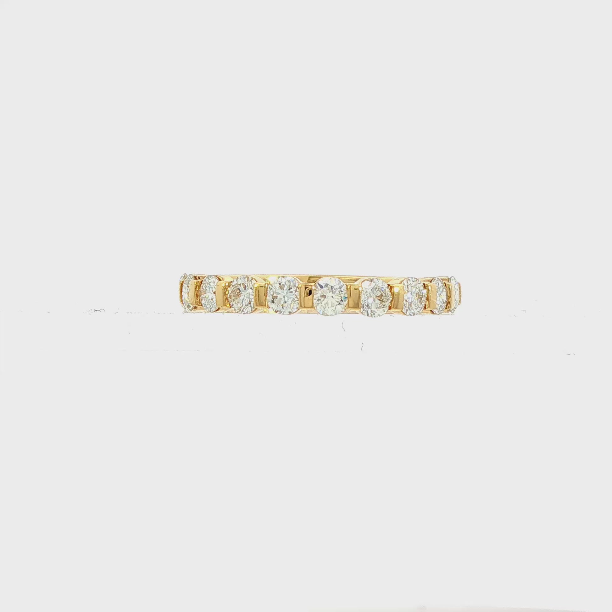 18K yellow gold band set with round brilliant diamonds. Item J38834 - ABC Jewelry Co. 