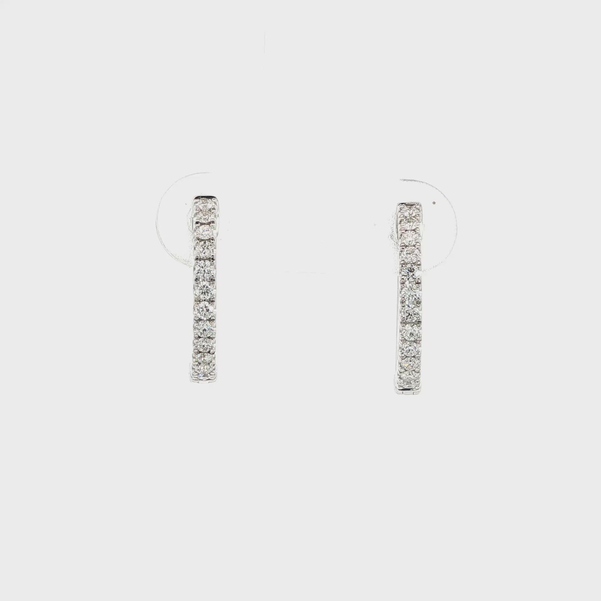 14K White gold hoop earrings set with round brilliant diamonds. Item number J38778 - ABC Jewelry Co.