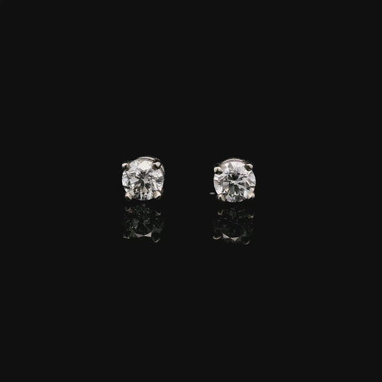 14K White gold stud earrings set with round brilliant diamonds. Item J33030 - ABC Jewelry Co.