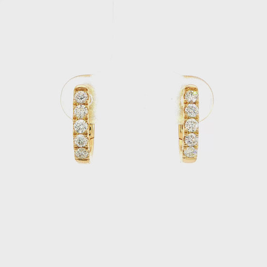 18K Yellow gold diamond set oval huggies. Item J38842 - ABC Jewelry Co.