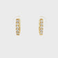 18K Yellow gold diamond set oval huggies. Item J38842 - ABC Jewelry Co.