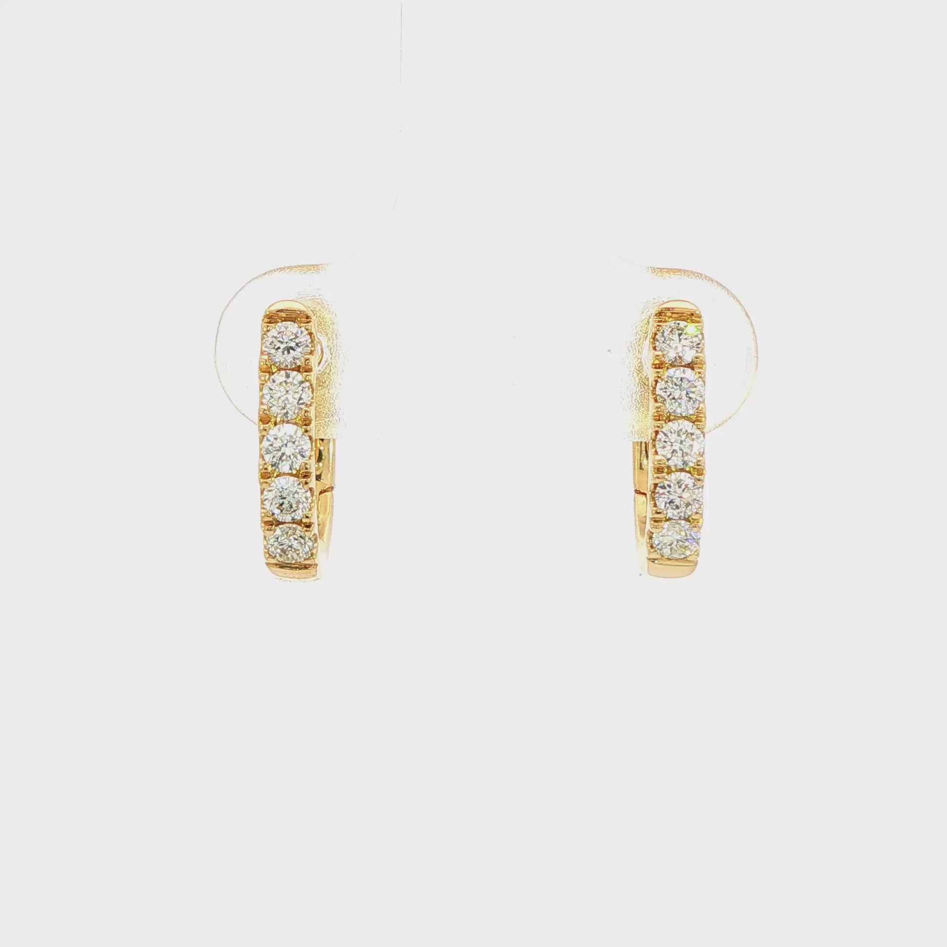 18K Yellow gold diamond set oval huggies. Item J38842 - ABC Jewelry Co.