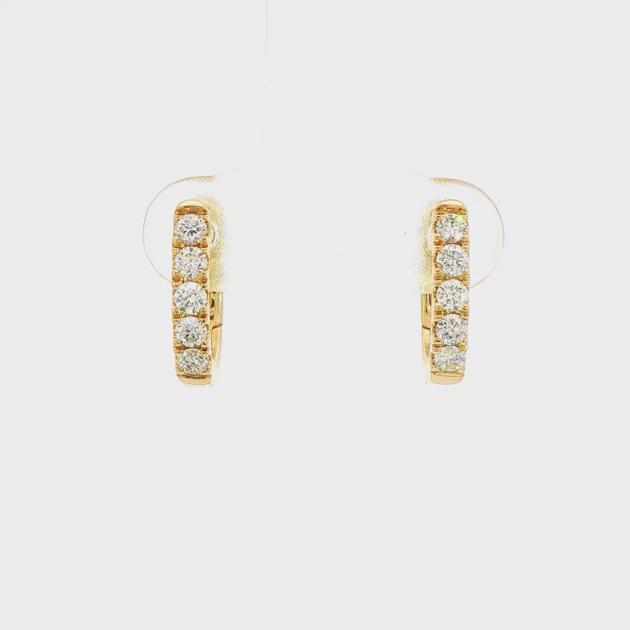 18K Yellow gold diamond set oval huggies. Item J38842 - ABC Jewelry Co.