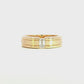 14K Yellow gold ring with satin finish inner band and polished edges, set with emerald cut diamond. Item J39319
