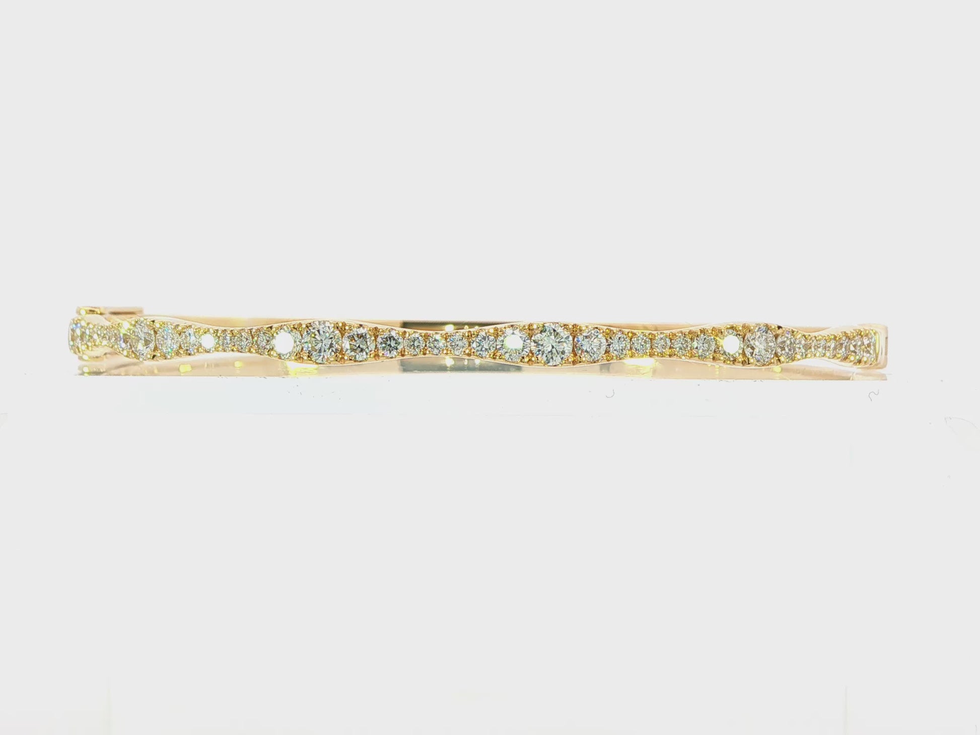 18K Yellow gold hinged bangle bracelet set with round brilliant diamonds. Item J38850 - ABC Jewelry Co. 
