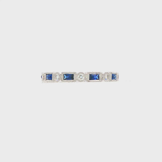 18K White gold eternity band set with blue sapphires and diamonds. Item J37559 - ABC Jewelry Co.