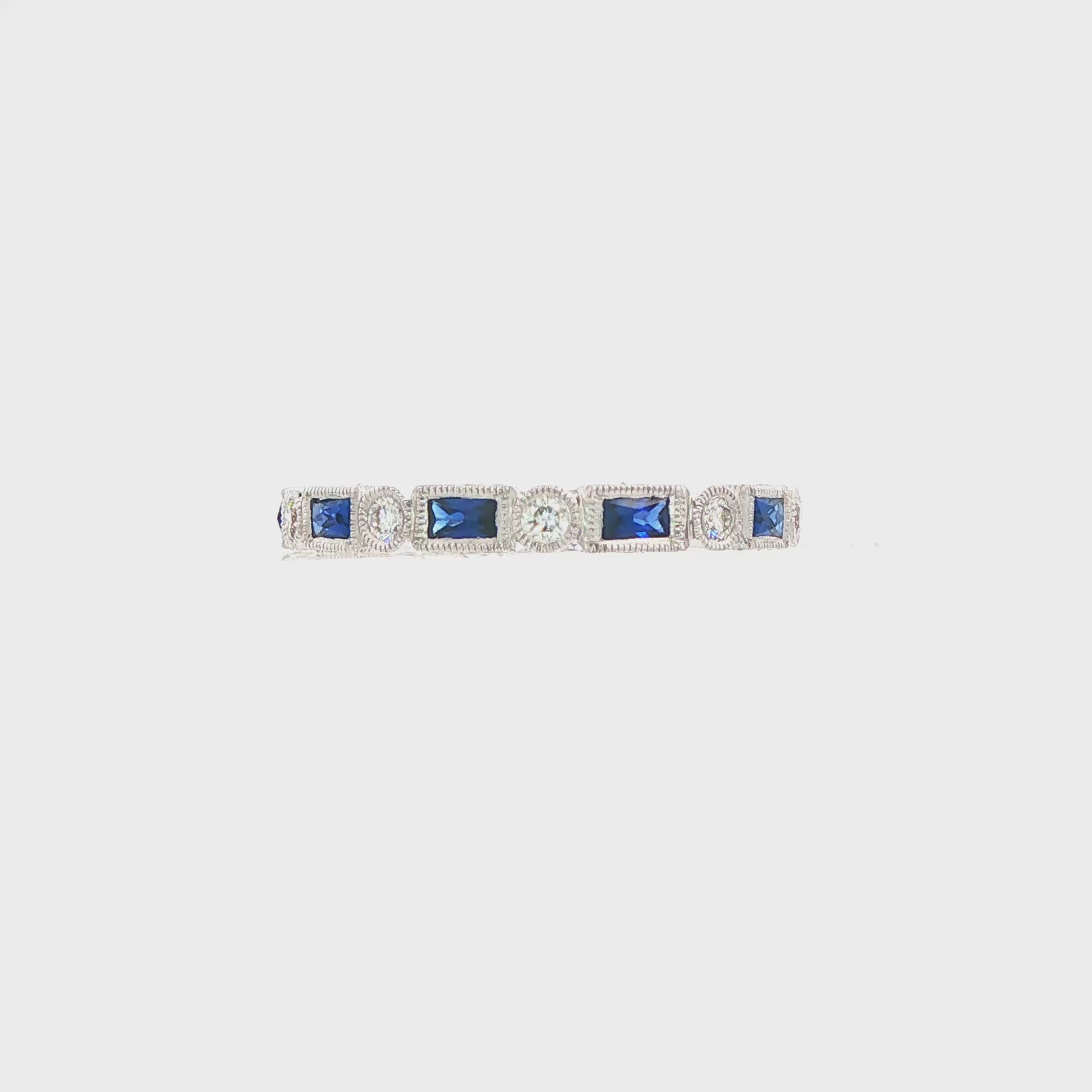18K White gold eternity band set with blue sapphires and diamonds. Item J37559 - ABC Jewelry Co.