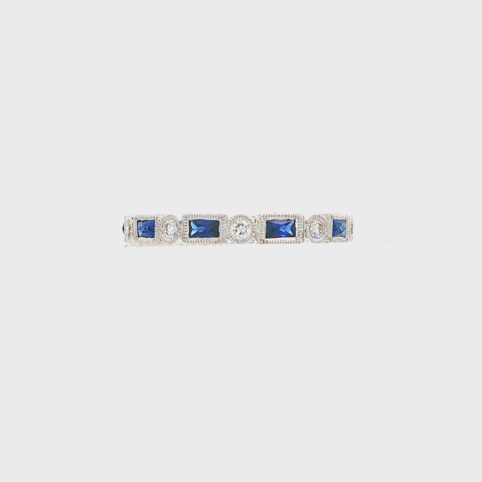 18K White gold eternity band set with blue sapphires and diamonds. Item J37559 - ABC Jewelry Co.