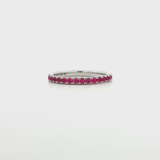 18K White gold eternity band set with brilliant cut rubies. Item J37475 - ABC Jewelry Co. 