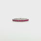 18K White gold eternity band set with brilliant cut rubies. Item J37475 - ABC Jewelry Co. 