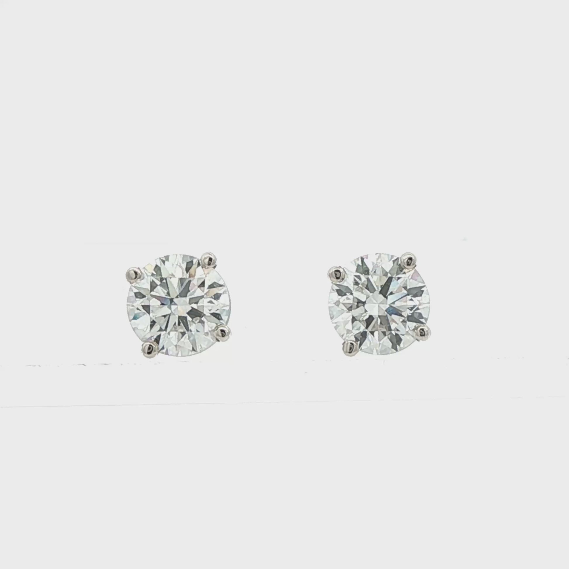 14K White gold studs with round brilliant diamonds. Item J38584 - ABC Jewelry Co. 