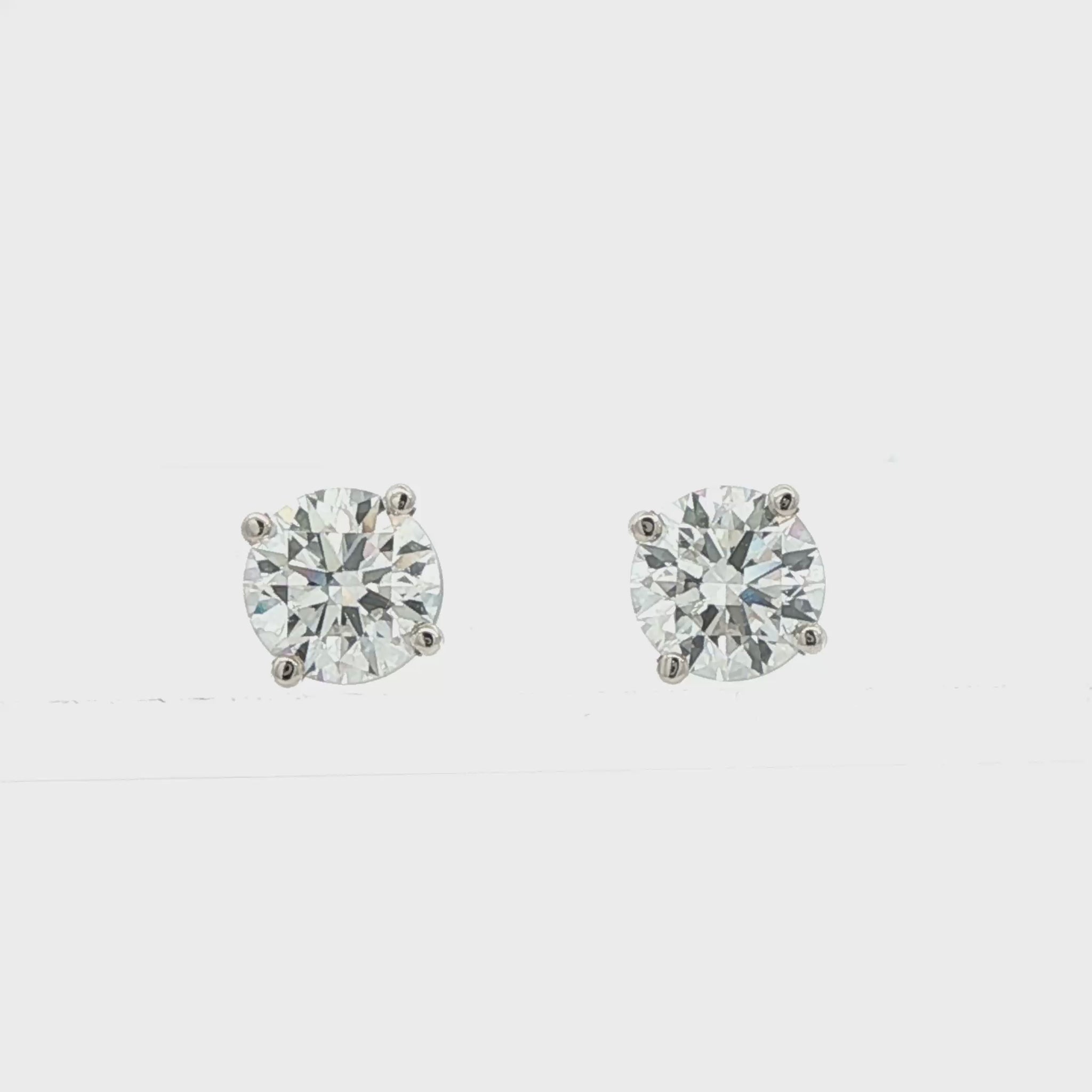 14K White gold studs with round brilliant diamonds. Item J38584 - ABC Jewelry Co. 