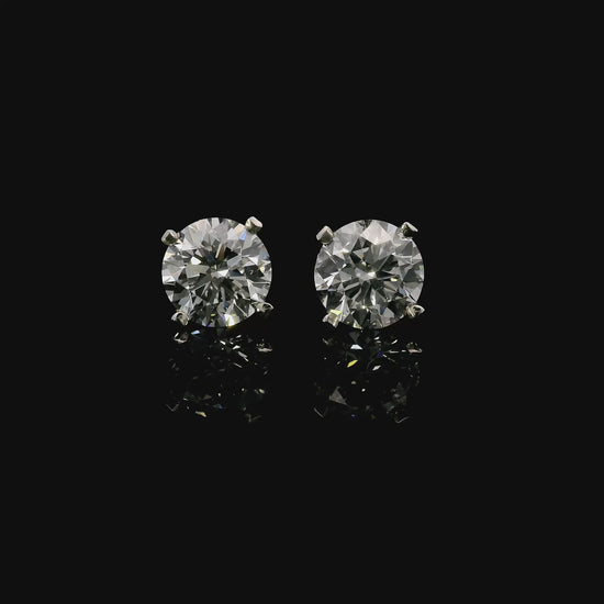 14K White gold stud earrings set with round brilliant diamonds. Item J37811 - ABC Jewelry Co.