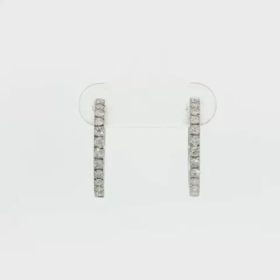18K White gold hoop earrings set with a row of round brilliant diamonds. Item J36133 - ABC Jewelry Co. 