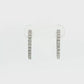 18K White gold hoop earrings set with a row of round brilliant diamonds. Item J36133 - ABC Jewelry Co. 