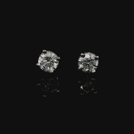 14K White gold stud earrings set with round brilliant diamonds. Item J38637 - ABC Jewelry Co. 