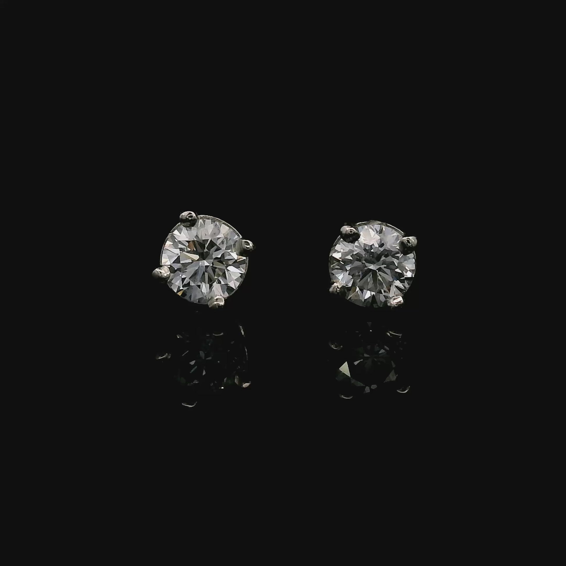 14K White gold stud earrings set with round brilliant diamonds. Item J38637 - ABC Jewelry Co. 
