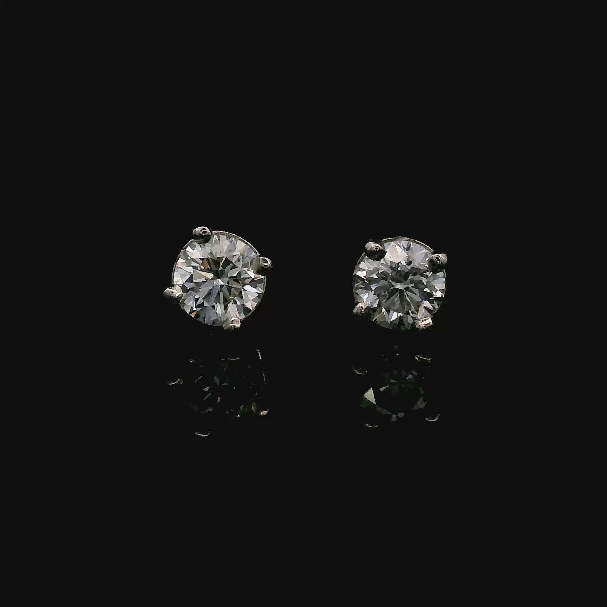 14K White gold stud earrings set with round brilliant diamonds. Item J38637 - ABC Jewelry Co. 