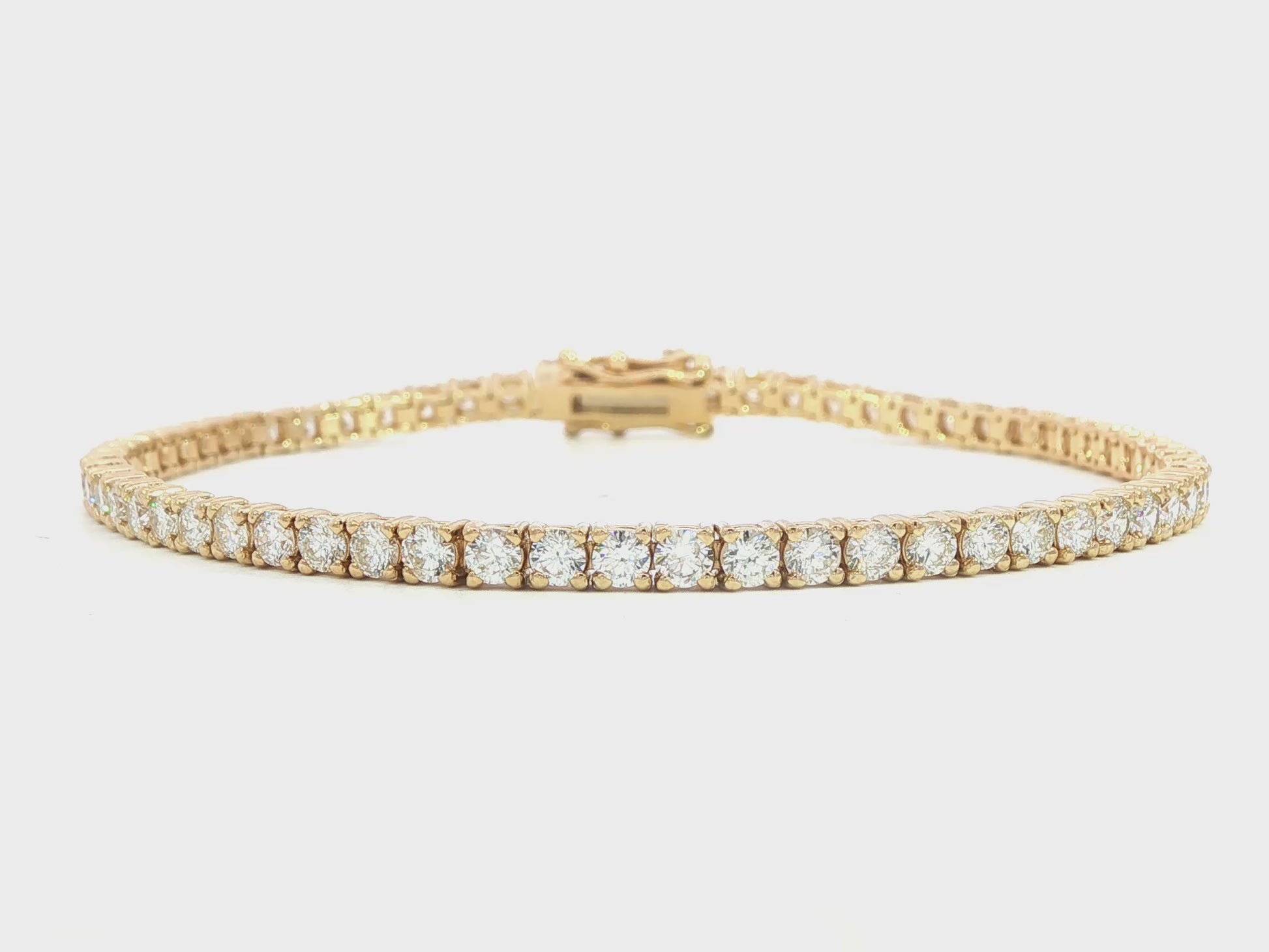 14K Yellow gold tennis bracelet set with round brilliant diamonds. Item J38987 - ABC Jewelry Co. 