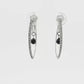 18K White gold diamond set hoop earrings with a black diamond briolette drop in the center of each. Item 19445 - ABC Jewelry Co. 