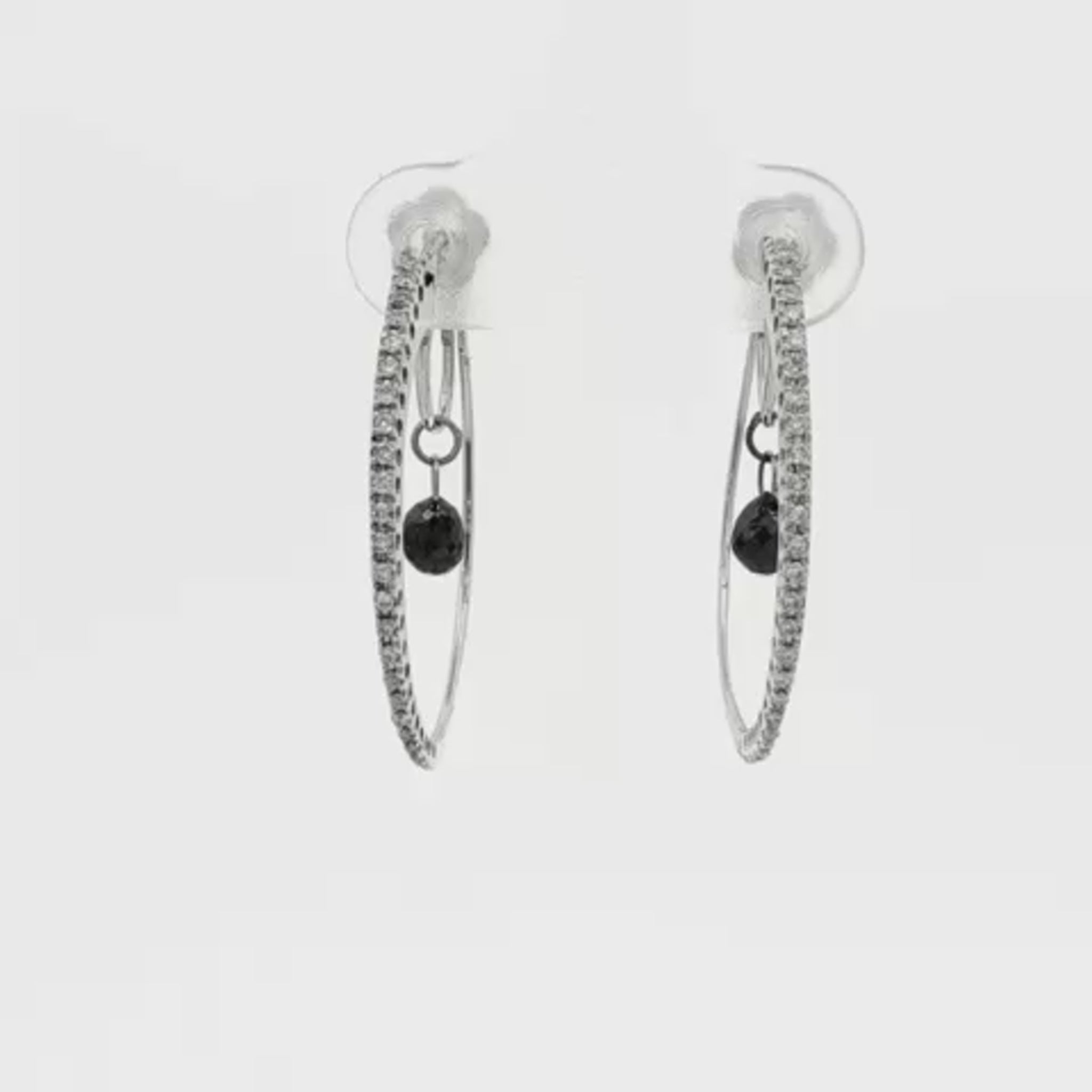 18K White gold diamond set hoop earrings with a black diamond briolette drop in the center of each. Item 19445 - ABC Jewelry Co. 