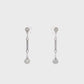 18K White gold dangle earrings with bezel set round brilliant diamonds. Item J36883 - ABC Jewelry Co. 