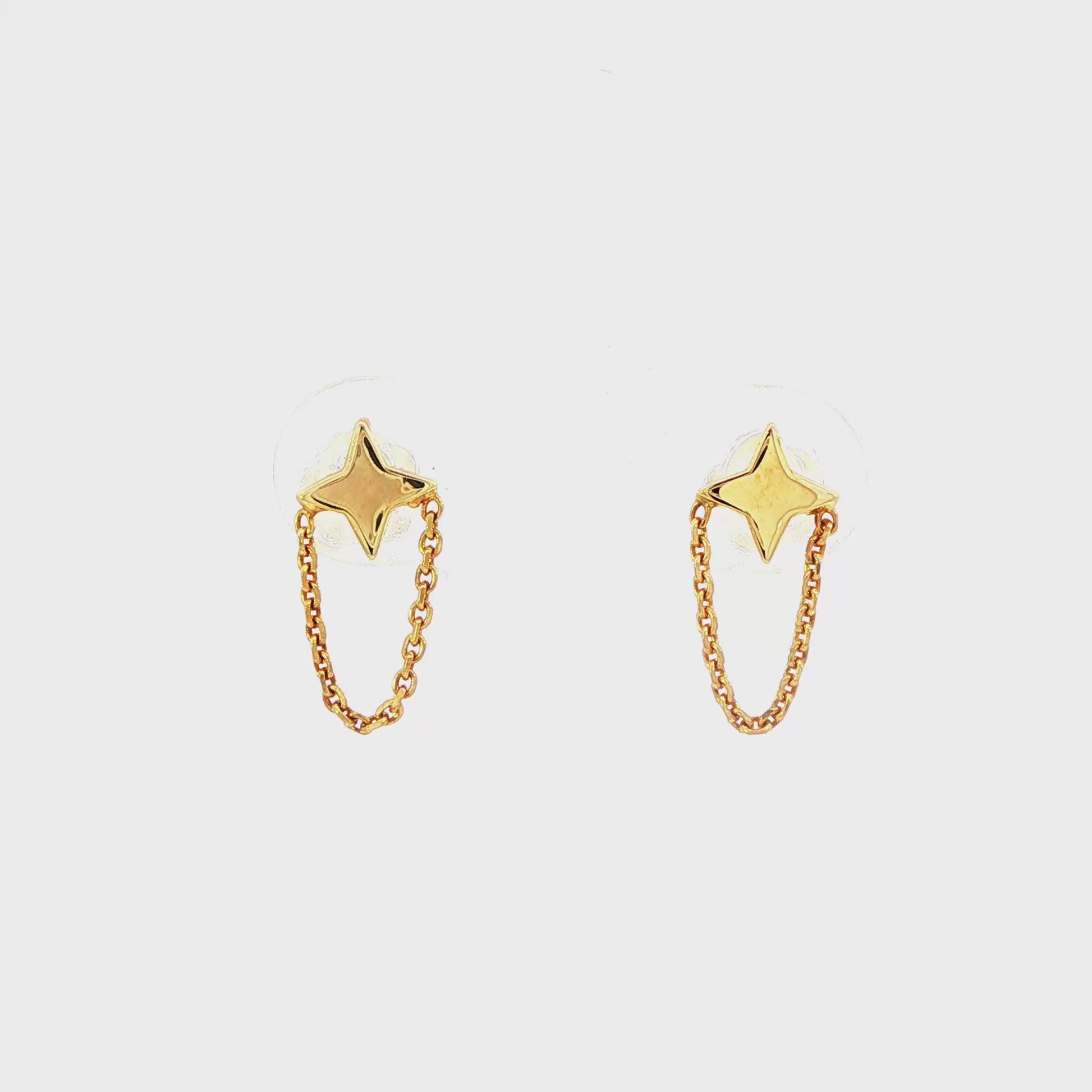 14K Yellow gold star burst earrings with delicate chain accents. Item J32110 - ABC Jewelry Co. 
