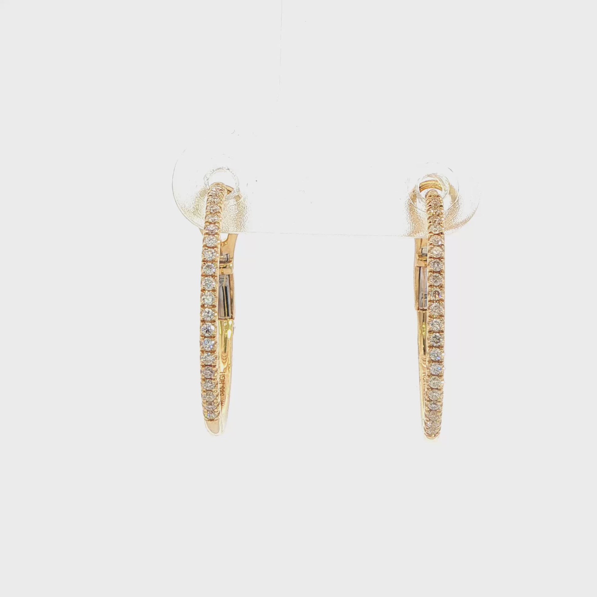 14K Yellow gold hoop earrings set with round brilliant diamonds. Item J38771 - ABC Jewelry Co