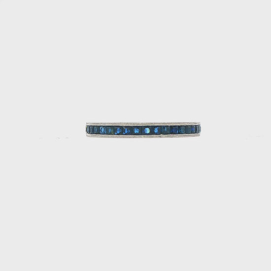 14K White gold band channel set with princess cut blue diamonds. Item 17614 - ABC Jewelry Co.