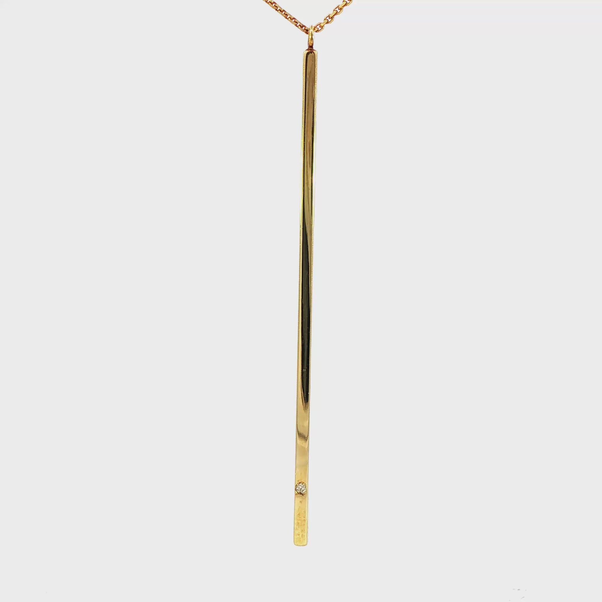 14K Yellow gold necklace with long bar pendant set with one round diamond. Item J34522 - ABC Jewelry Co.