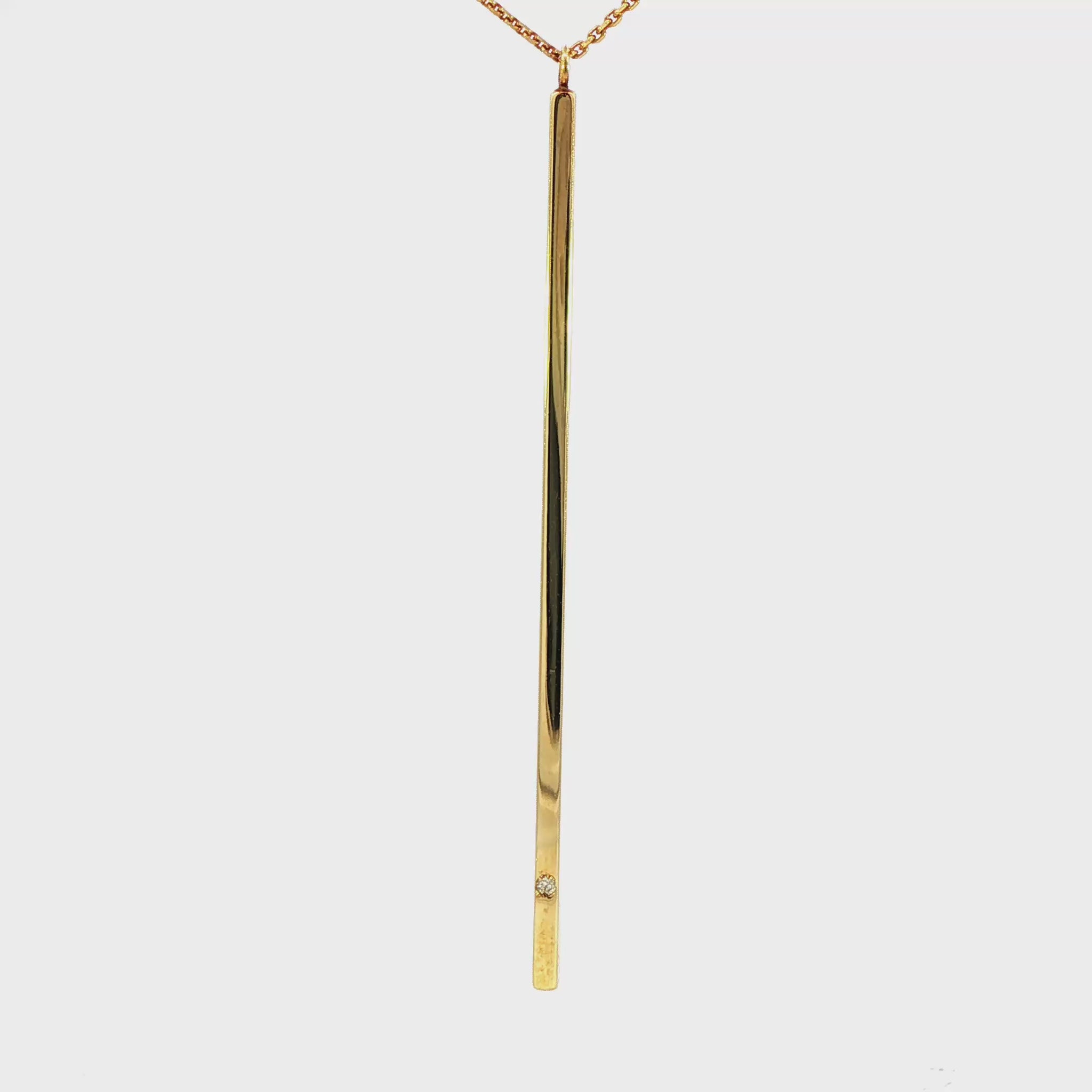 14K Yellow gold necklace with long bar pendant set with one round diamond. Item J34522 - ABC Jewelry Co.