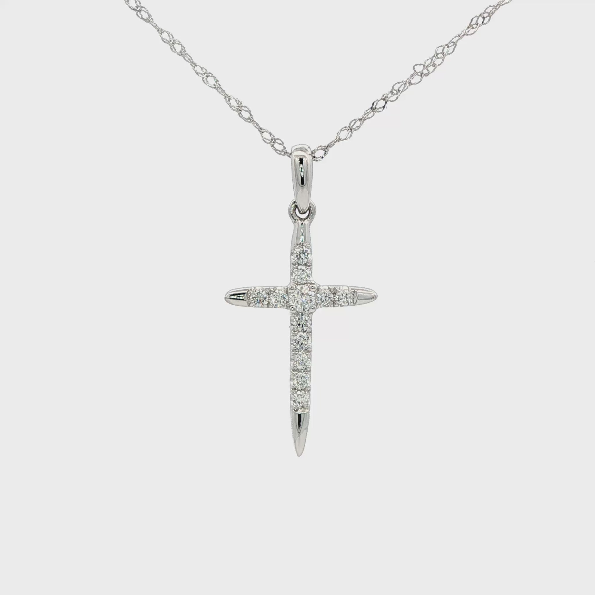 14K White gold cross necklace set with round brilliant diamonds. Item J38764 - ABC Jewelry Co. 