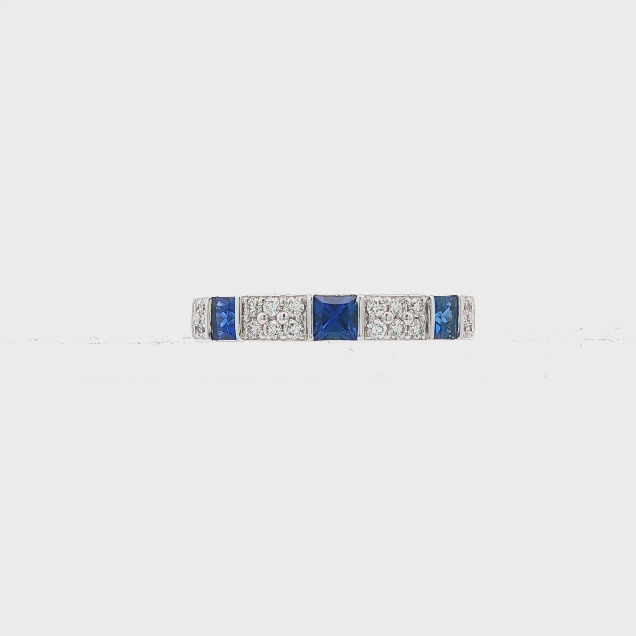 18K White gold band with square cut sapphires and row of round brilliant diamonds. Item J38783 - ABC Jewelry Co. 