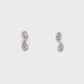 18K White gold diamond earrings, each set with two pear shape diamonds in a vertical design. Item J37096 - ABC Jewelry Co