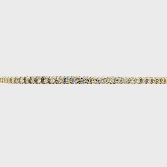 14K Yellow gold bangle bracelet set with round brilliant diamonds. Item J38576 - ABC Jewelry Co. 