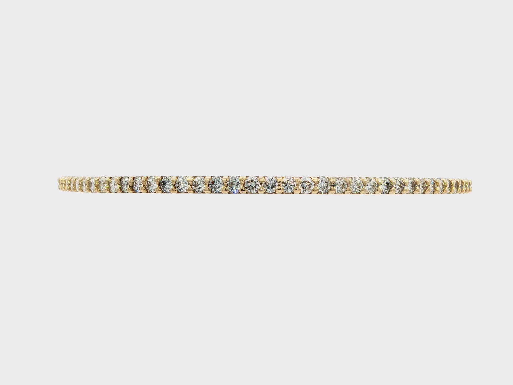 14K Yellow gold bangle bracelet set with round brilliant diamonds. Item J38576 - ABC Jewelry Co. 