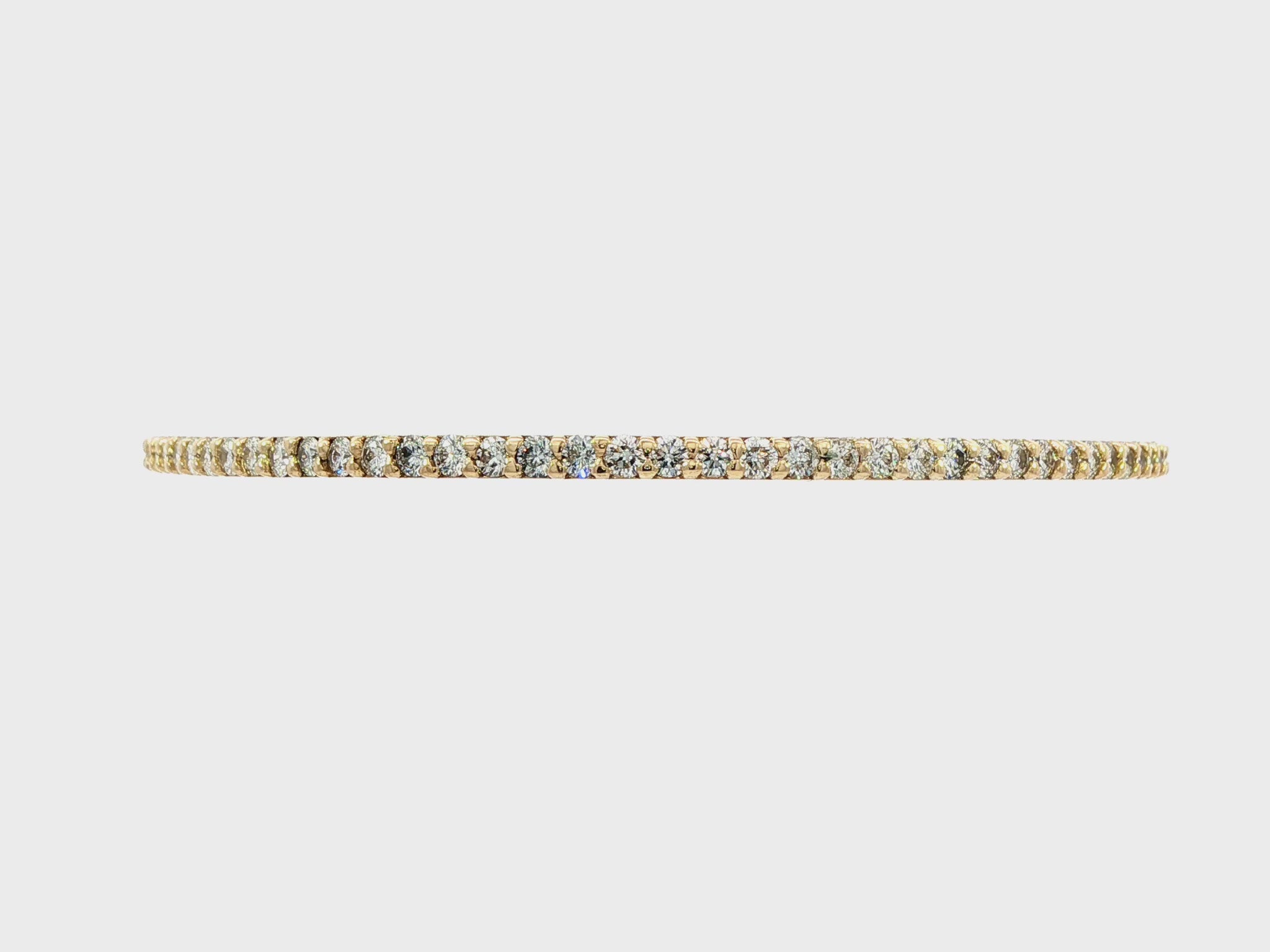 14K Yellow gold bangle bracelet set with round brilliant diamonds. Item J38576 - ABC Jewelry Co. 
