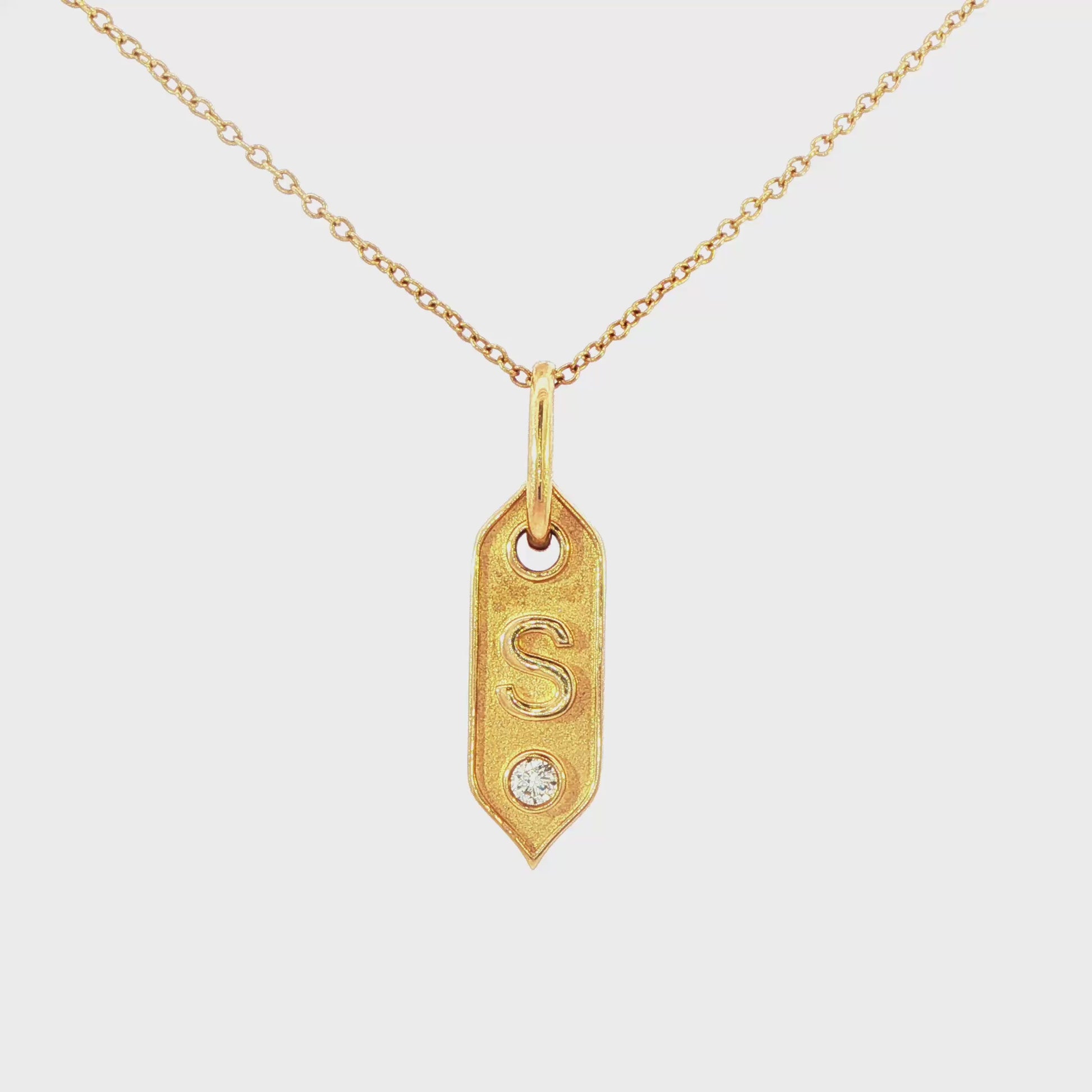 14K Yellow gold pendant necklace with initial "S" and one round brilliant diamond. Item J35419 - ABC Jewelry Co.