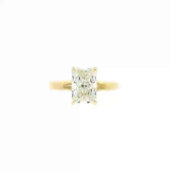 14K Yellow gold solitaire engagement ring set with radiant cut diamond. Item J37991 - ABC Jewelry Co. 