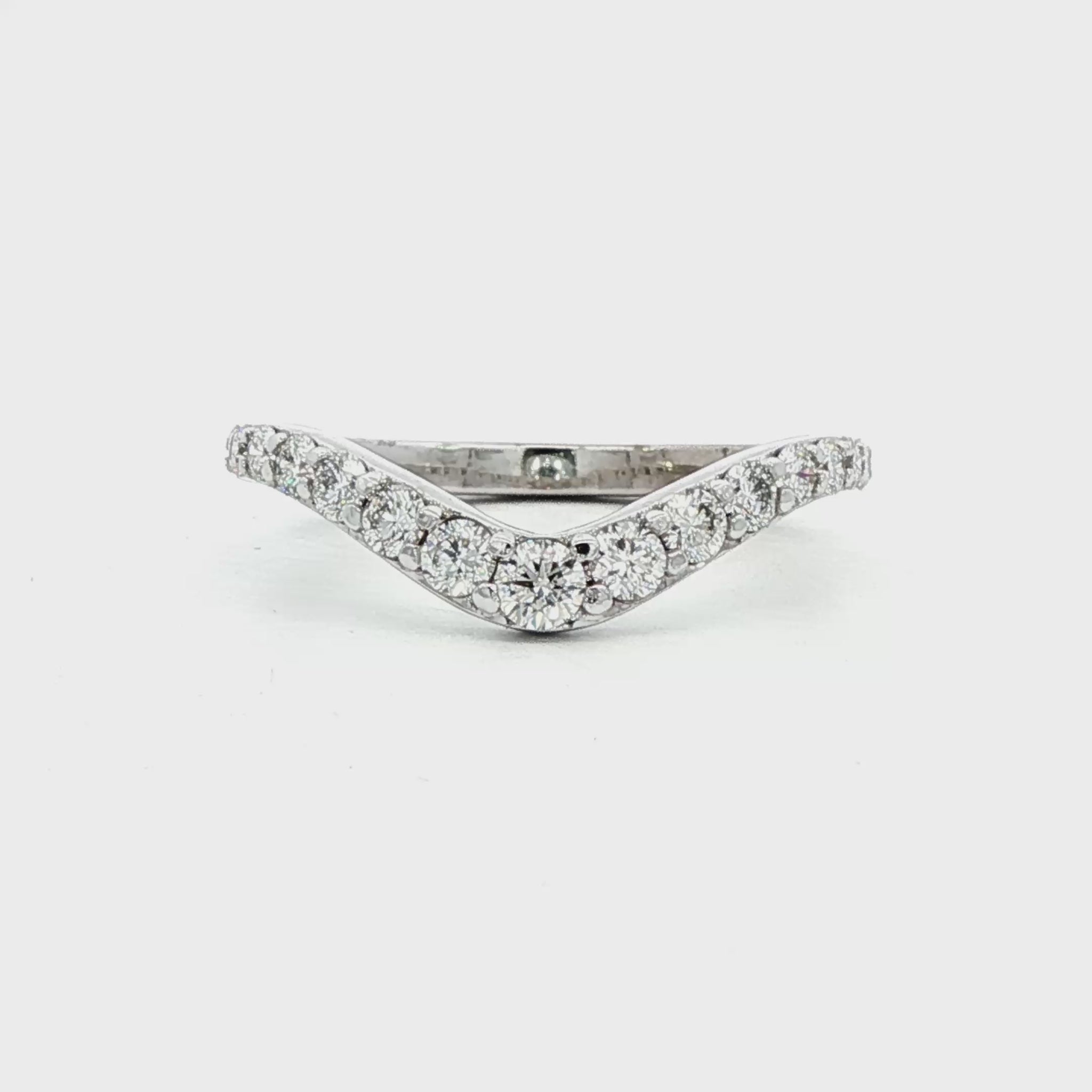 14K White gold curved diamond band set with round brilliant diamonds. Item J38574 - ABC Jewelry Co. 